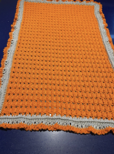 orange and silver baby blanket